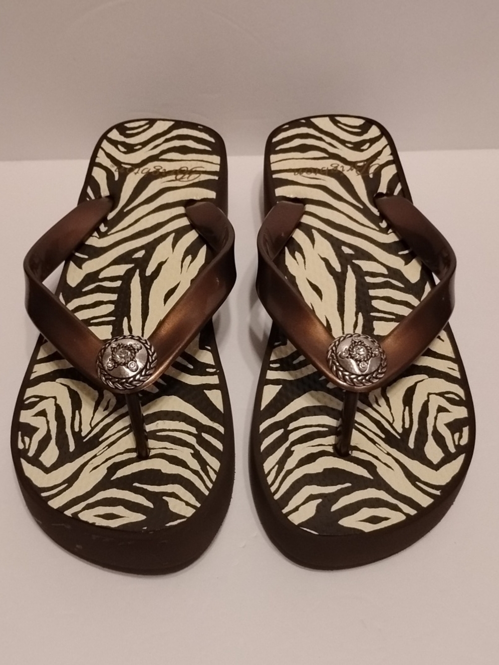 Z-047 Women’s Brown Zebra-Print Flip Flop Sandals with Decorative Medallion